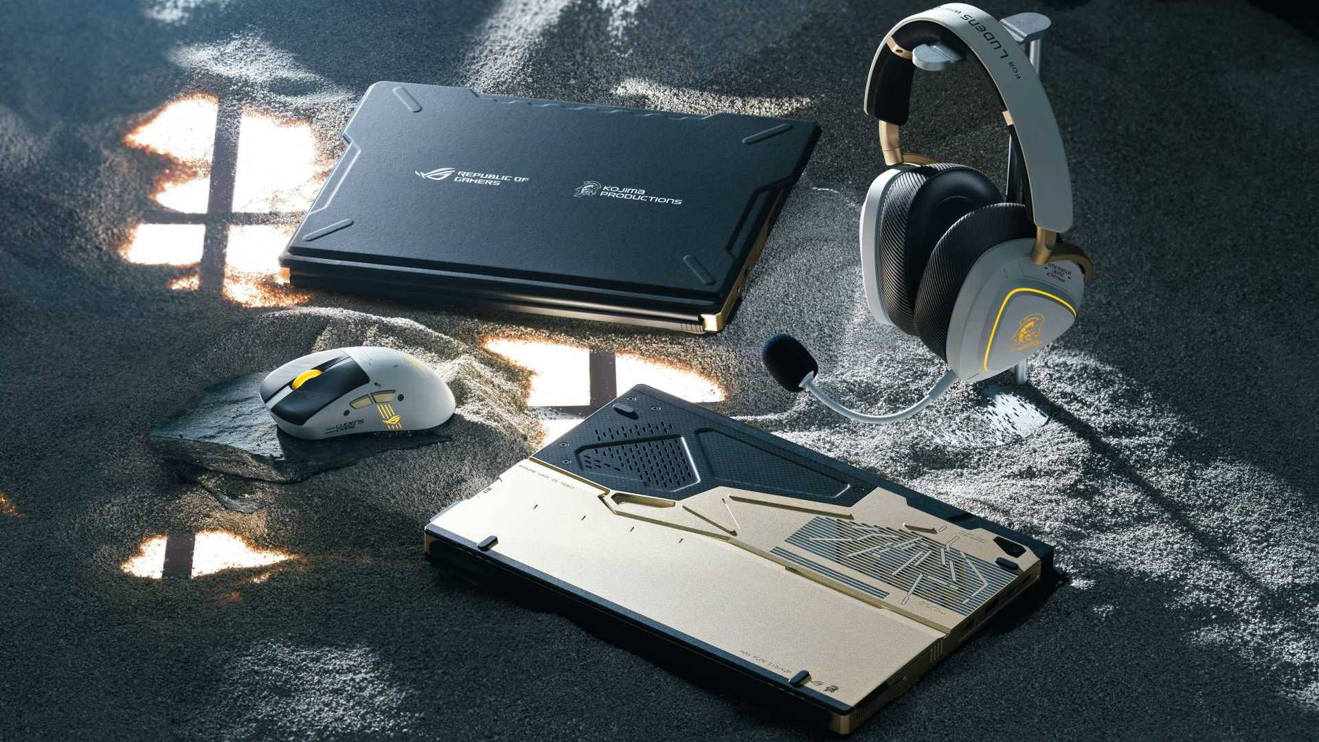 Image of the ROG x Kojima Productions products including a tablet, headset and gaming mouse sitting on sand.