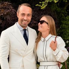 Alizee Thevenet wears French brands Sezane and Longchamp at the Wimbledon Women's Singles Final, posing with husband James Middleton who wears a cream suit