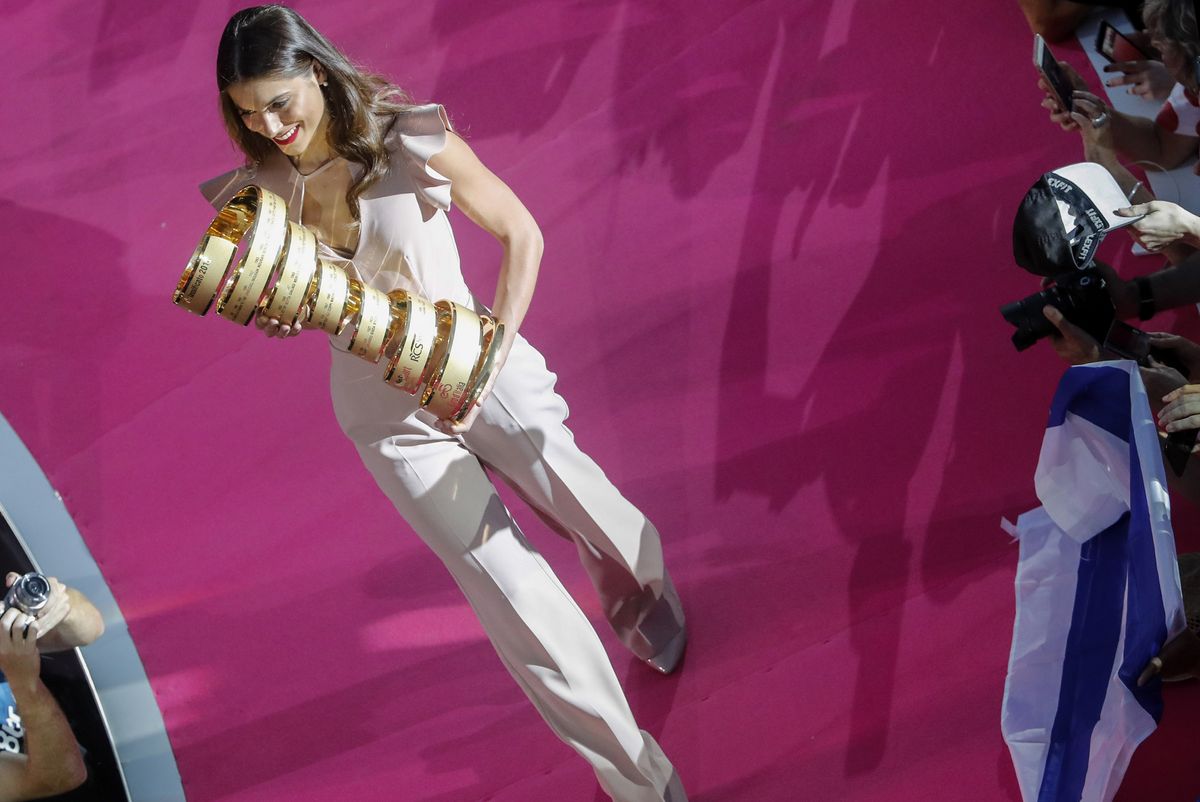 The Giro d'Italia trophy is brought in