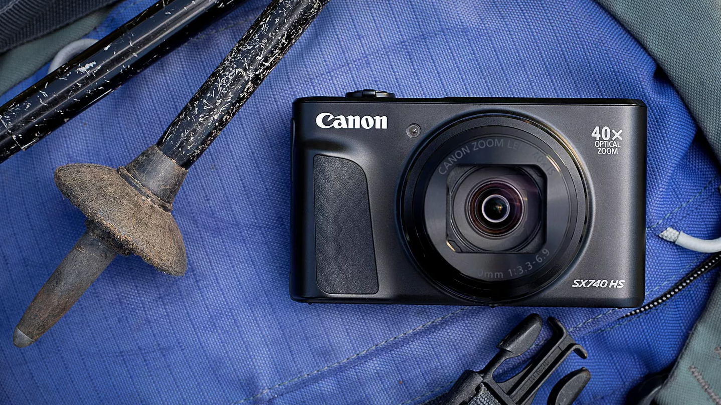 Canon Ixus 285 HS A Lite sitting on top of hiking equipment