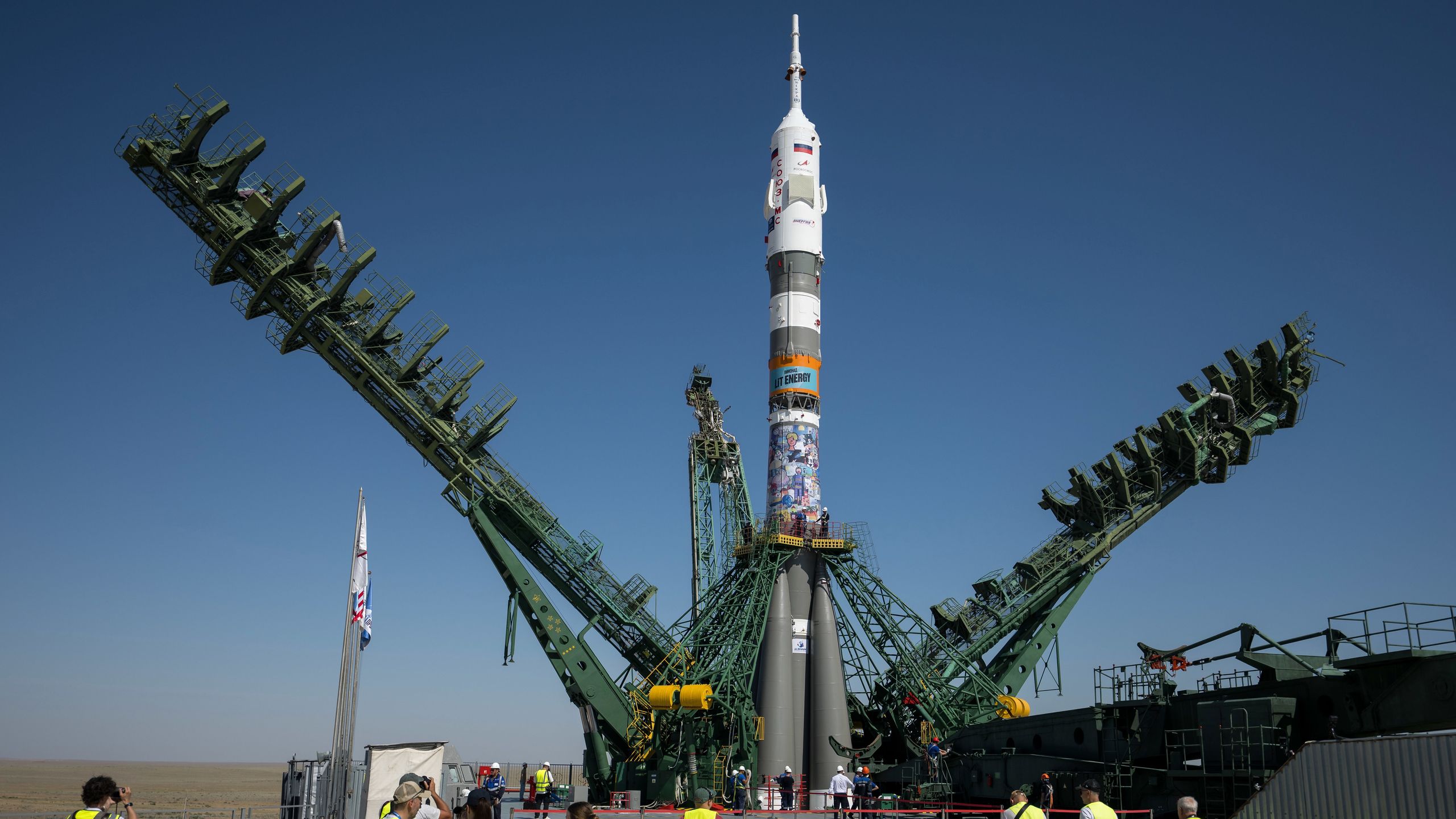 Astronauts simply launched on a Soyuz rocket with an energy-drink advert, persevering with a Russian custom