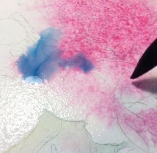 A blend of blue and pink watercolour pigments