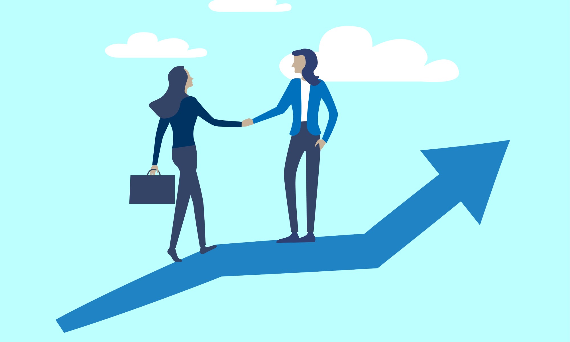 Two business women shaking hands 