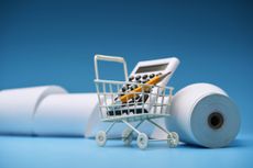 shopping cart calculator and pencil and receipts