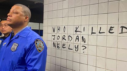 Police officer at Jordan Neely protest