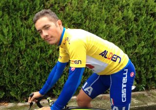 Italian Vincenzo Albanese wears the leader's jersey of the Tour de l'Avenir