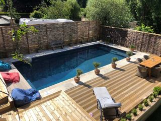 Home Counties Pools & Hot Tubs pool with fence and decking