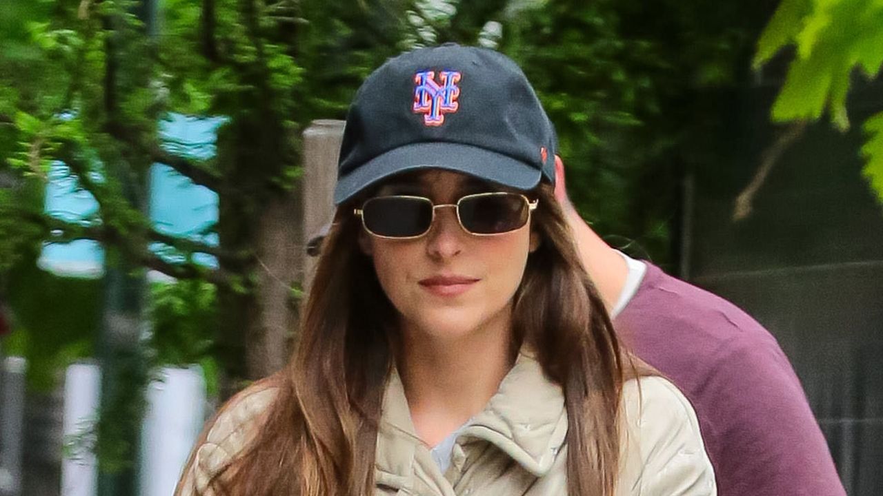 Dakota Johnson wearing white jeans and nike trainers on set of Materialists on May 9, 2024 in New York City