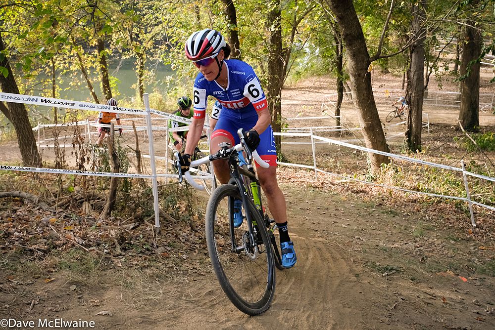Katerina Nash (Cliff Bar Pro Team) winding her way through the woods while riding in second place