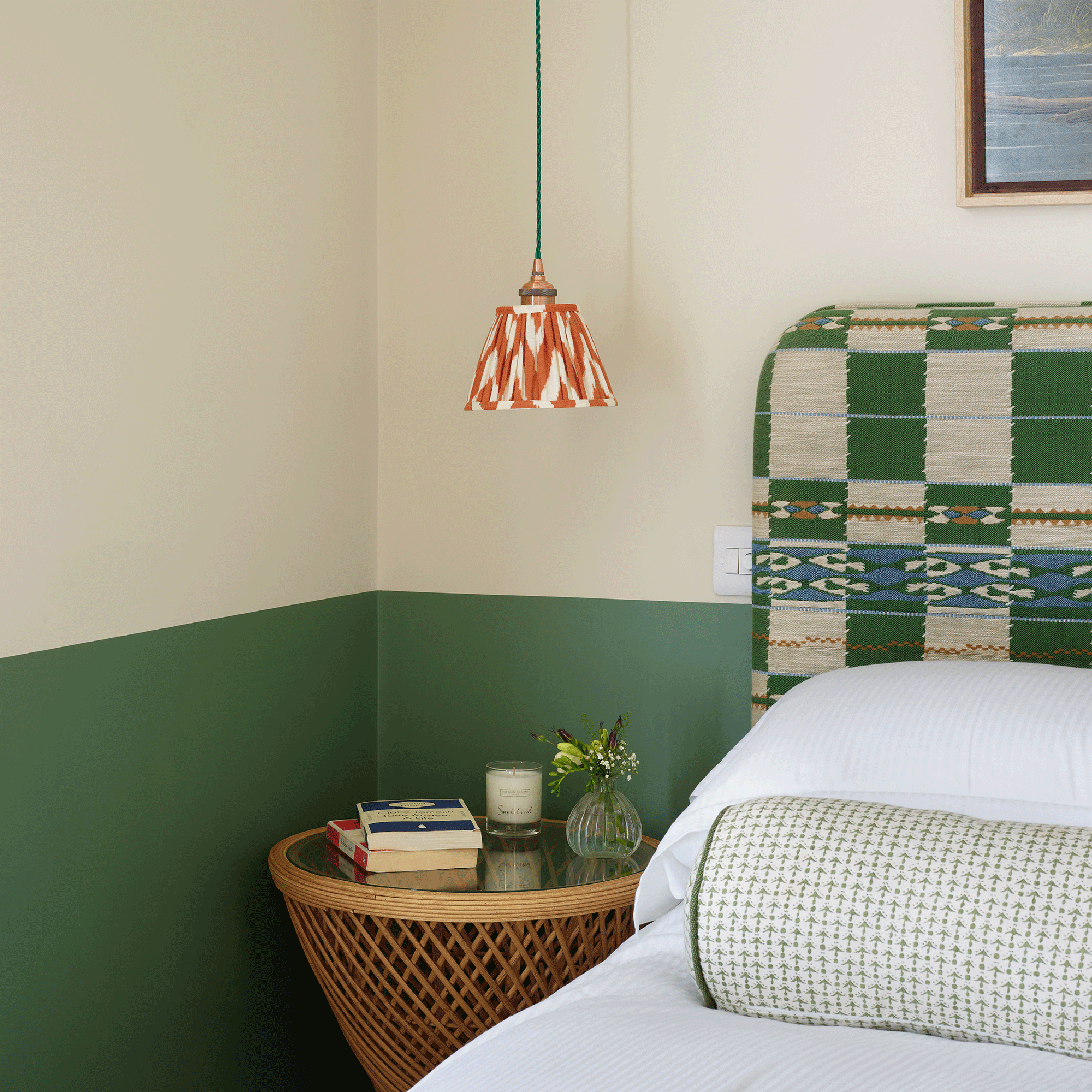 Green and white painted wall with check headboard