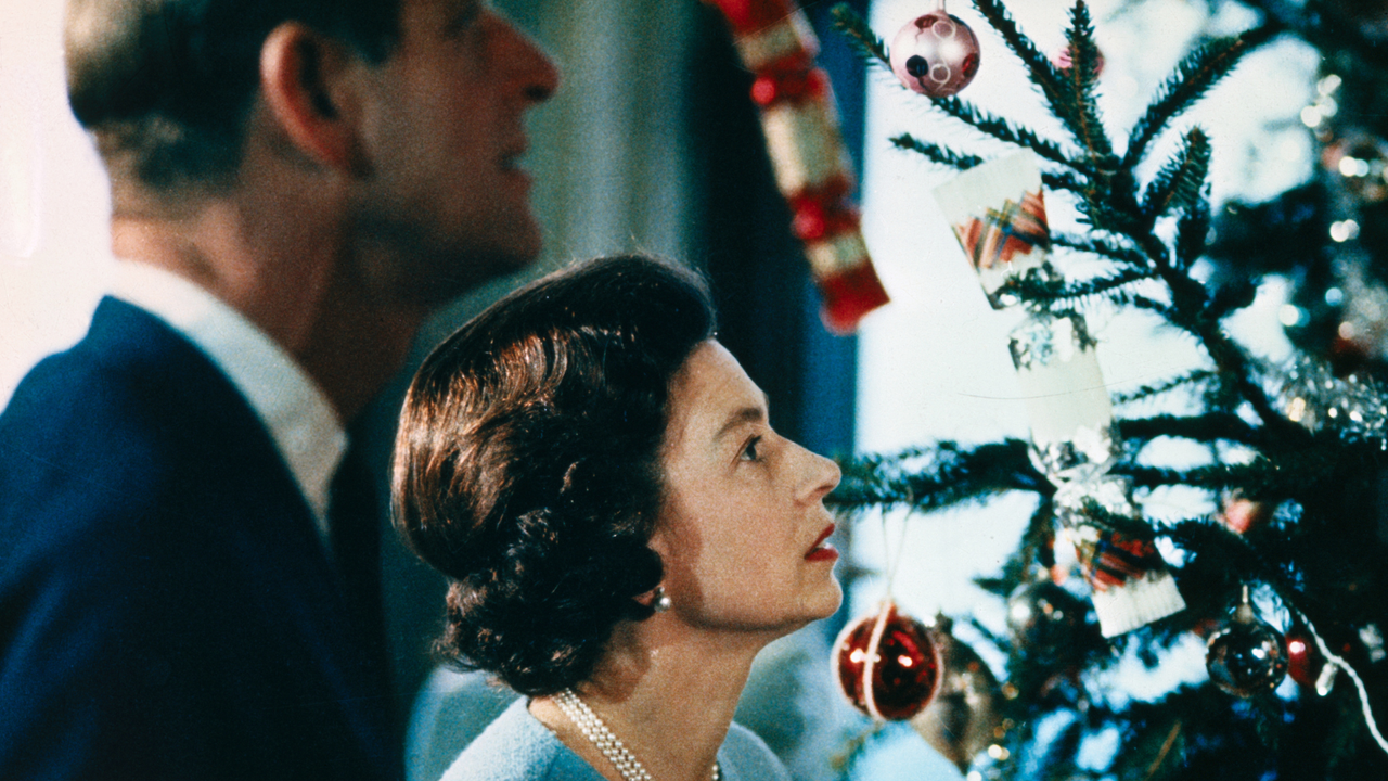 Christmas at Windsor Castle is shown here with Queen Elizabeth II and Prince Philip shown putting finishing touches to Christmas tree, in a photo made recently during the filming of the joint ITV-BBC film documentary, The Royal Family.