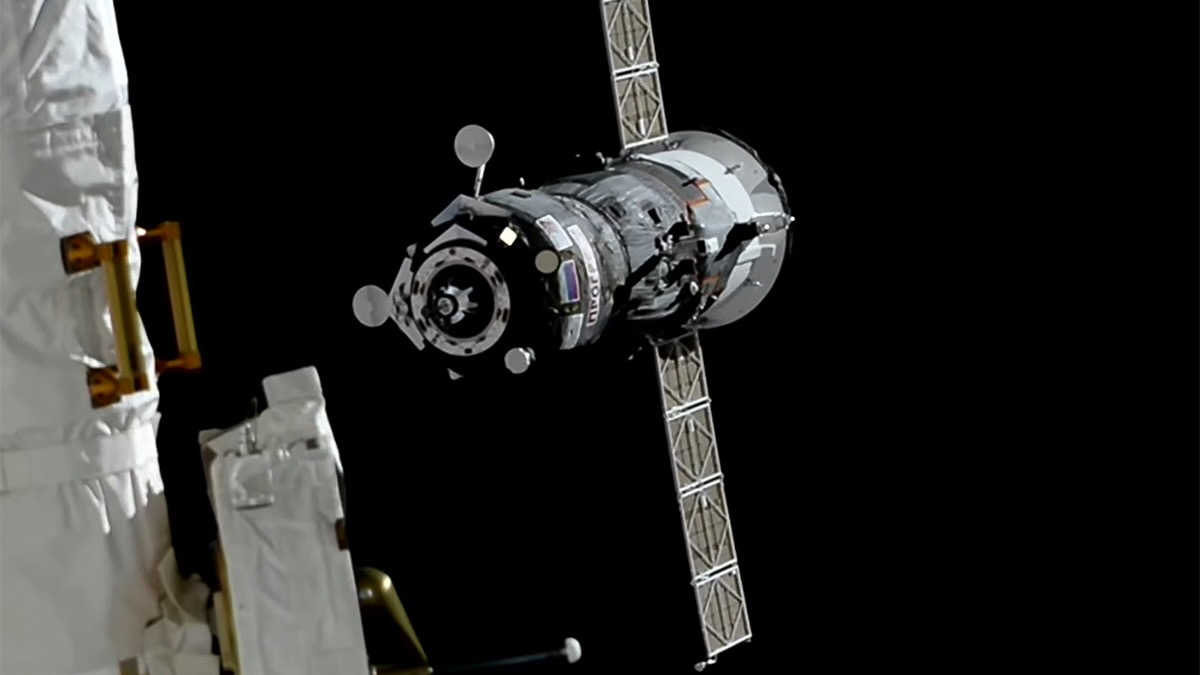closeup of a cylindrical spacecraft against the blackness of space