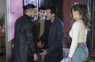 Nish Panesar pleading his case with Ravi Gulati while Nugget Gulati and Priya Nandra-Hart look on in the Panesar living room