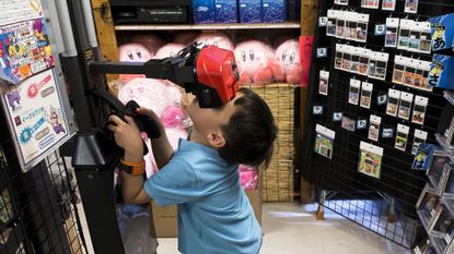 Nintendo Virtual Boy in use by child in Japanese games shop