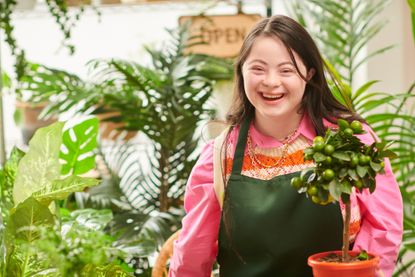 Florist in flower shop laughing