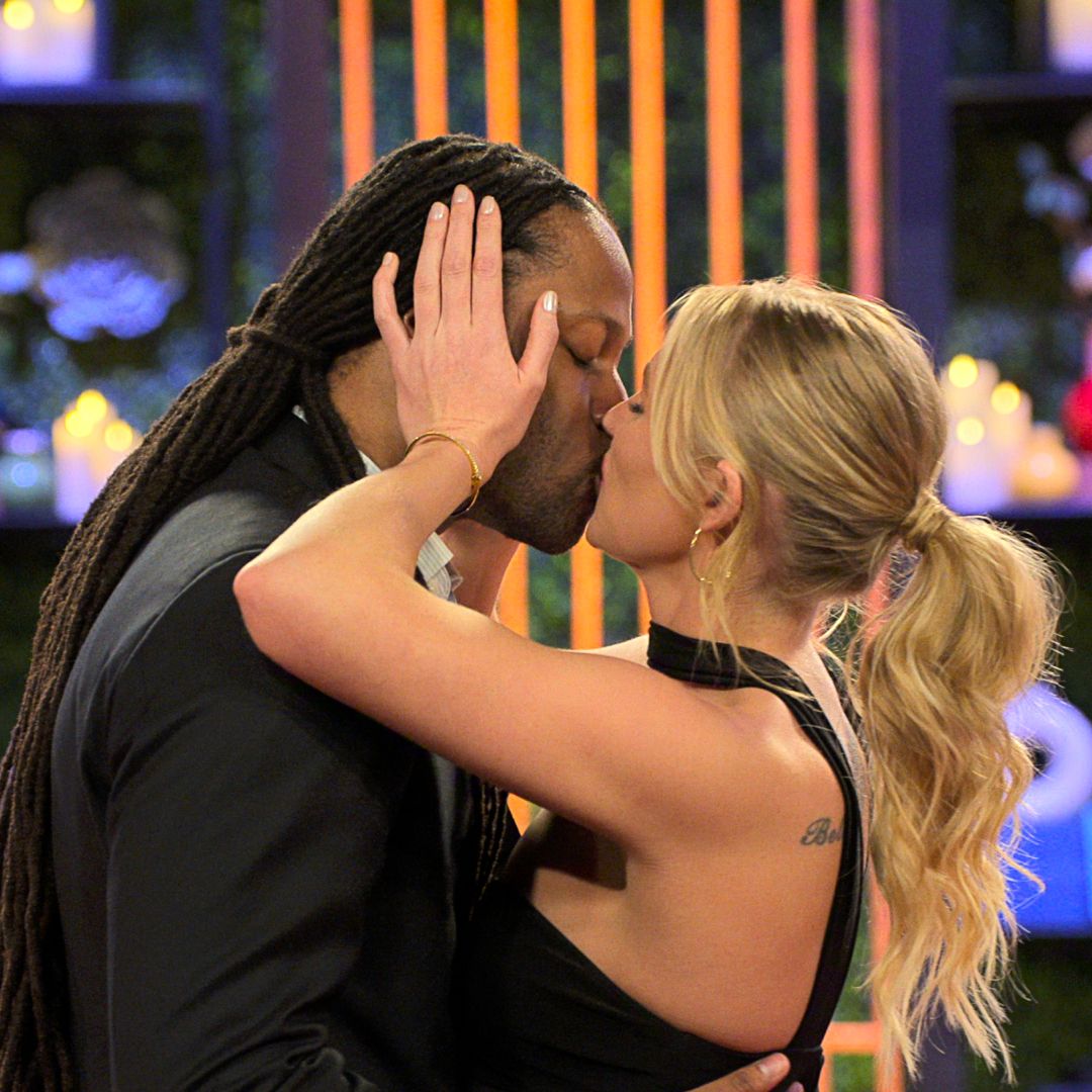 Dr Vic St John and Christine Hamilton kiss during their in-person reveal, in episode 1002 of Love Is Blind.