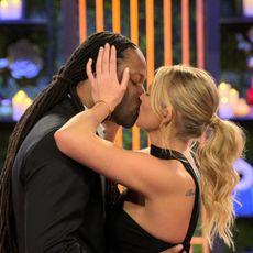 Dr Vic St John and Christine Hamilton kiss during their in-person reveal, in episode 1002 of Love Is Blind.