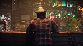 Wolverine sitting in a dive bar wearing a flannel shirt and a cowboy hat