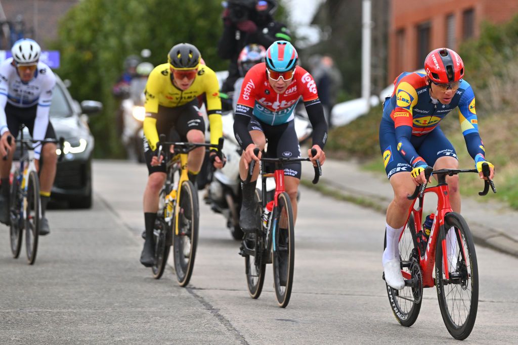 NINOVE BELGIUM FEBRUARY 24 LR Arnaud De Lie of Belgium and Team Lotto Dstny and Toms Skujins of Latvia and Team LidlTrek compete in the breakaway during the 79th Omloop Het Nieuwsblad 2024 Mens Elite a 2022km one day race from Ghent to Ninove UCIWT on February 24 2024 in Ninove Belgium Photo by Luc ClaessenGetty Images