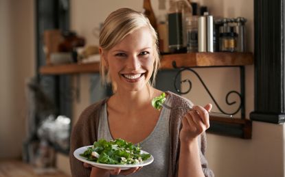 woman eating salad: vegetarian foods