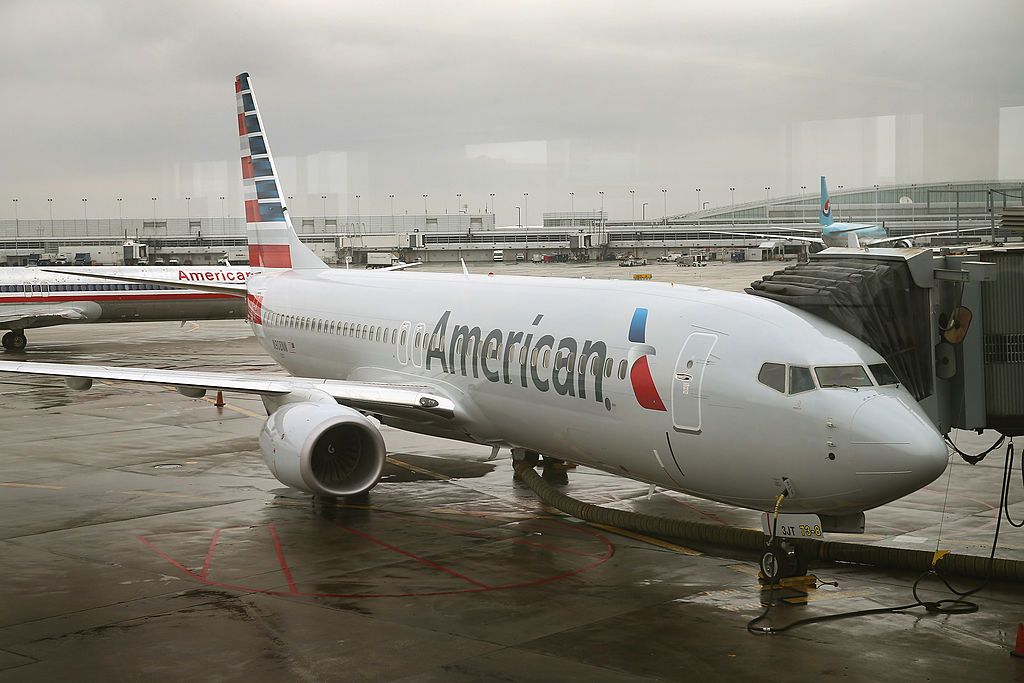 A new American Airlines 737-800 aircraft featuring a new paint job with the company’s new logo sits at a gate at O&amp;#039;Hare Airport on January 29, 2013 in Chicago, Illinois.