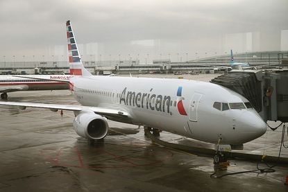 A new American Airlines 737-800 aircraft featuring a new paint job with the company’s new logo sits at a gate at O'Hare Airport on January 29, 2013 in Chicago, Illinois.