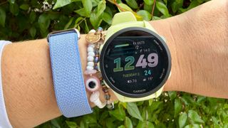 a photo of the Fitbit Air and Garmin Forerunner 70