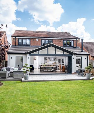 Kier and Paul Rhodes added a wraparound extension to turn their old house into the larger family home they needed