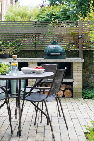 how to design an outdoor kitchen: Big Green Egg BBQ in an outdoor kitchen