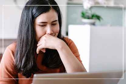 close up of woman using a laptop