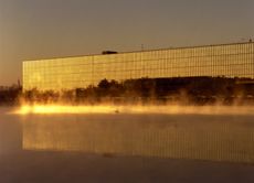 bell labs in holmdel in golden yellow light and reflected in water