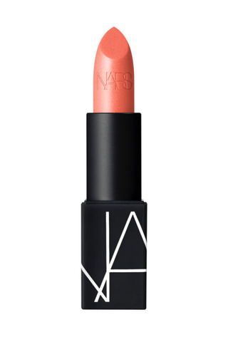 NARS Lipstick - Orgasm in front of a plain backdrop
