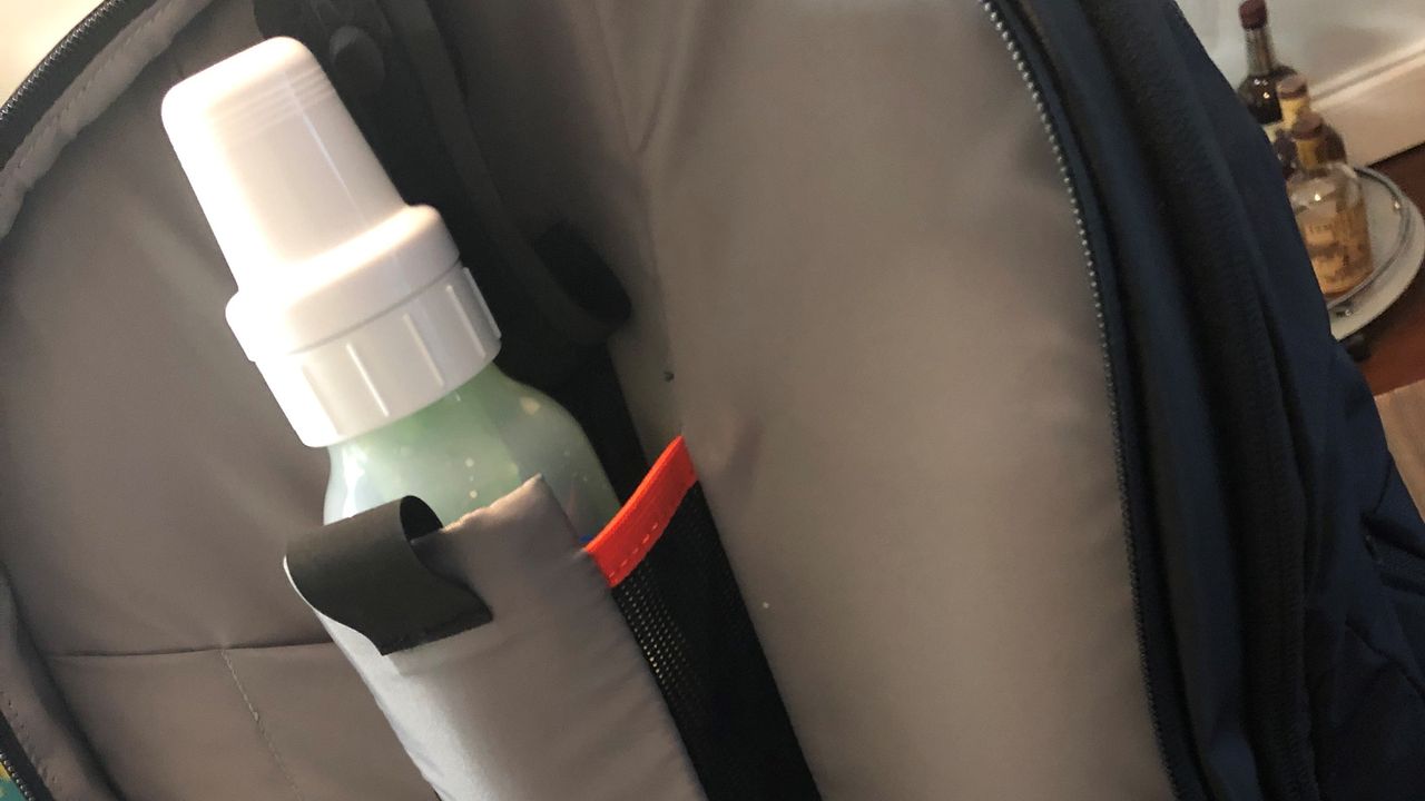 An opened BP35 backpack showing off baby bottle holder.