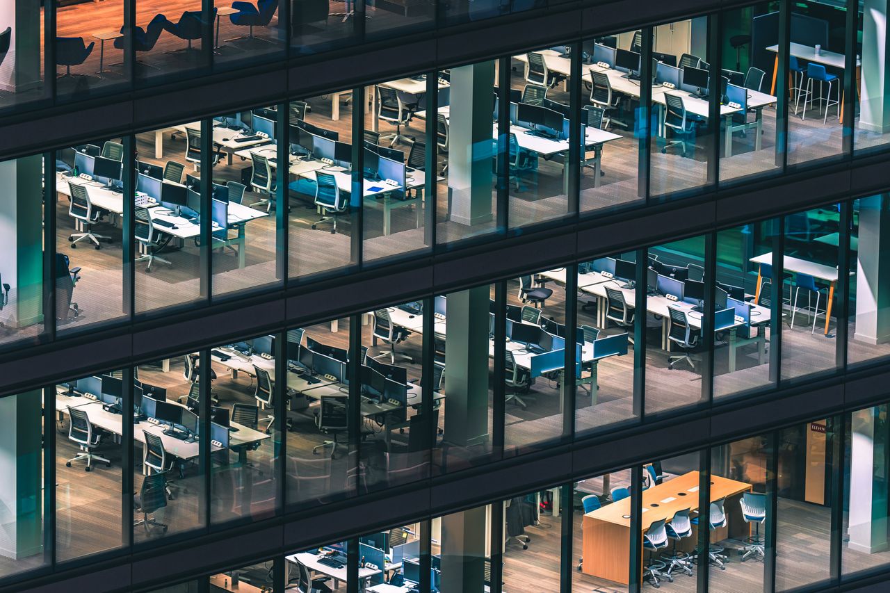 Modern glass office building at night