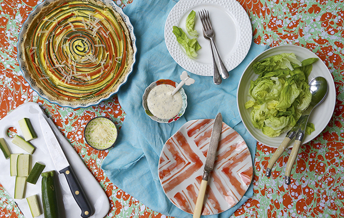 Spiral Provencal tart with Parmesan sauce and caper berries