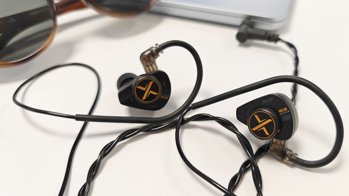 The Ooopus Op.22 earphones on a white desktop.