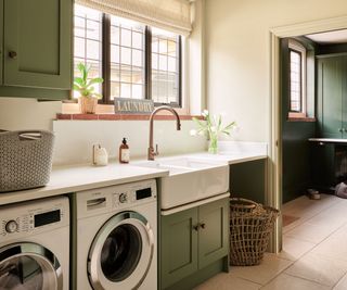 green Shaker utility room with Belfast sink