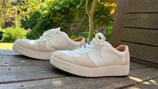 Fitflop trainers side by side on a wooden table