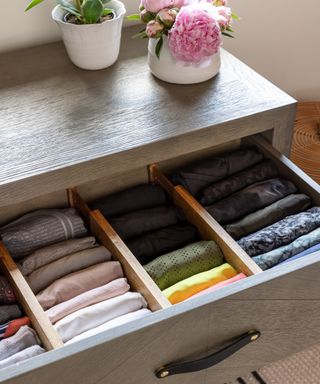 Neatly organized drawers with expandable wooden inserts to keep items separated