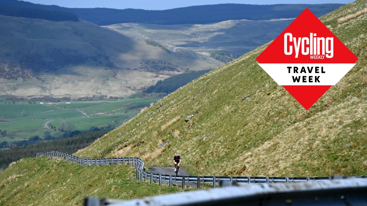 Image shows a person cycling in Scotland