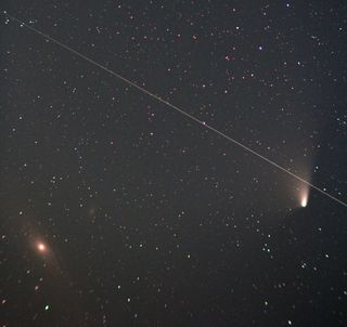 Comet Pan-STARRS in conjunction with the great Andromeda Galaxy, M31, and a satellite on April 5, 2013.