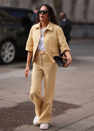 Woman wearing a tweed co ord in London