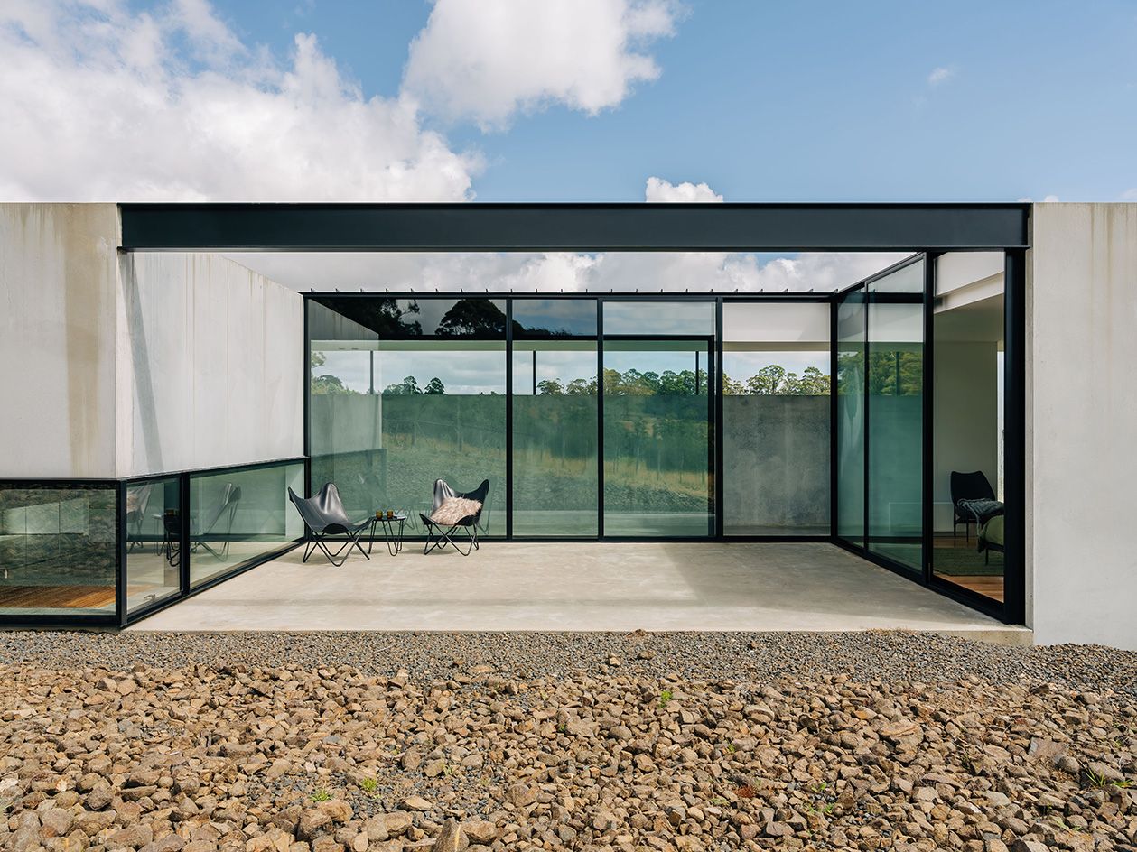 view on patio of koonya concrete tasmania house by room 11