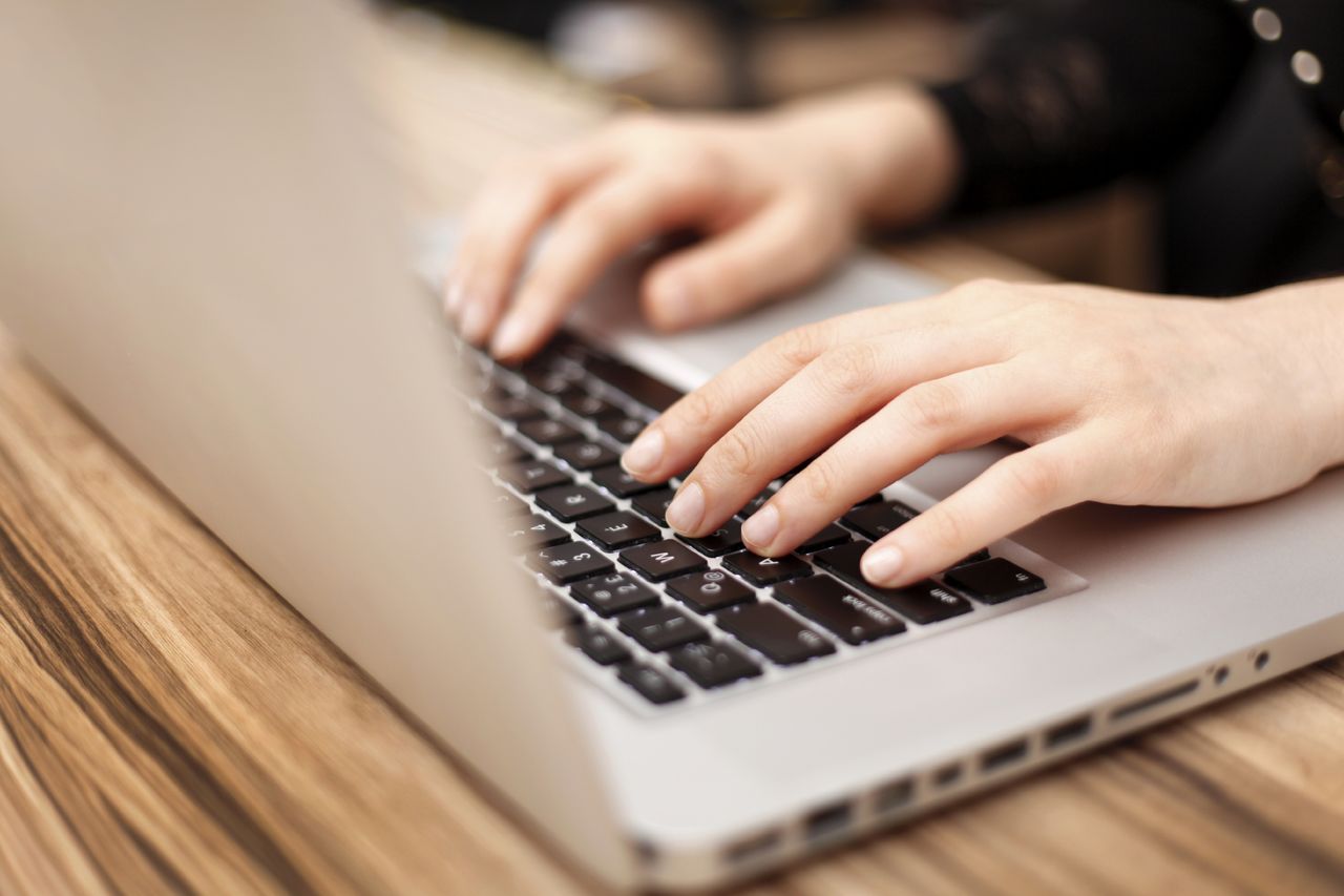 A person typing on a keyboard