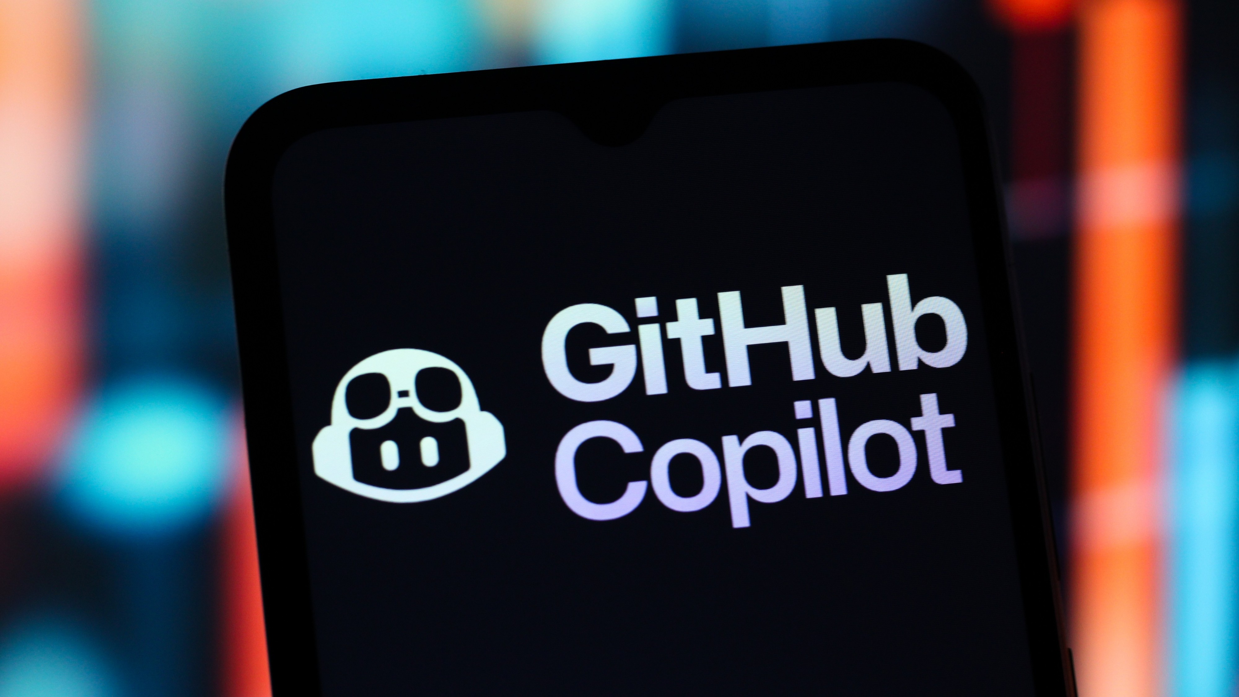 In this photo illustration, the GitHub Copilot logo is seen displayed on a smartphone screen.