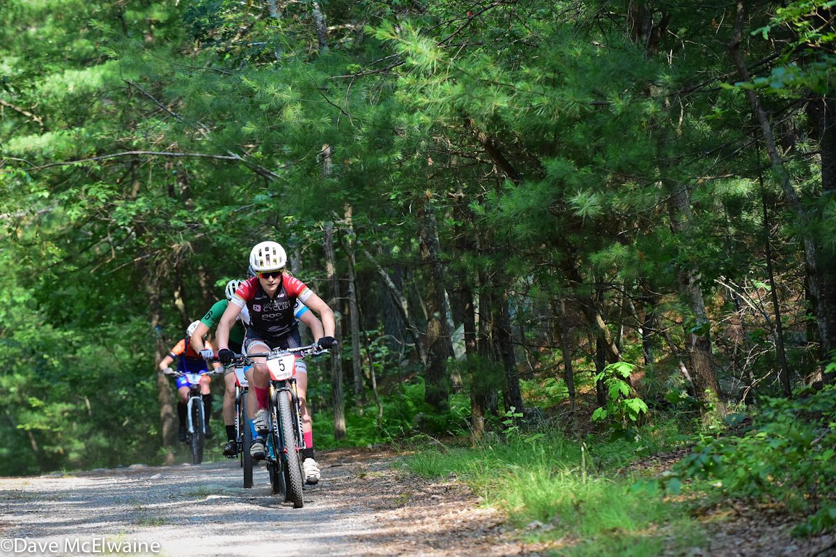 Ellen Noble (Competitive Cyclist) leading on the fire road during lap one