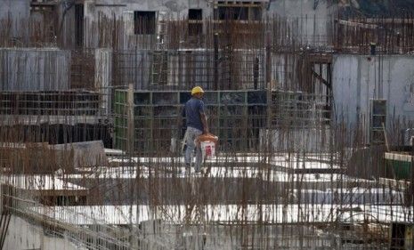 A laborer works on Israel-owned settlements in the West Bank.