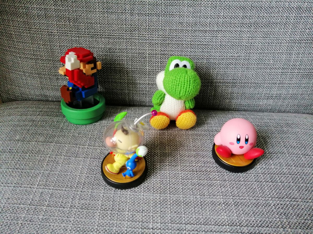 The same indoor shot with more natural light improves things, but the noise is still evident on Mario and Kirby.