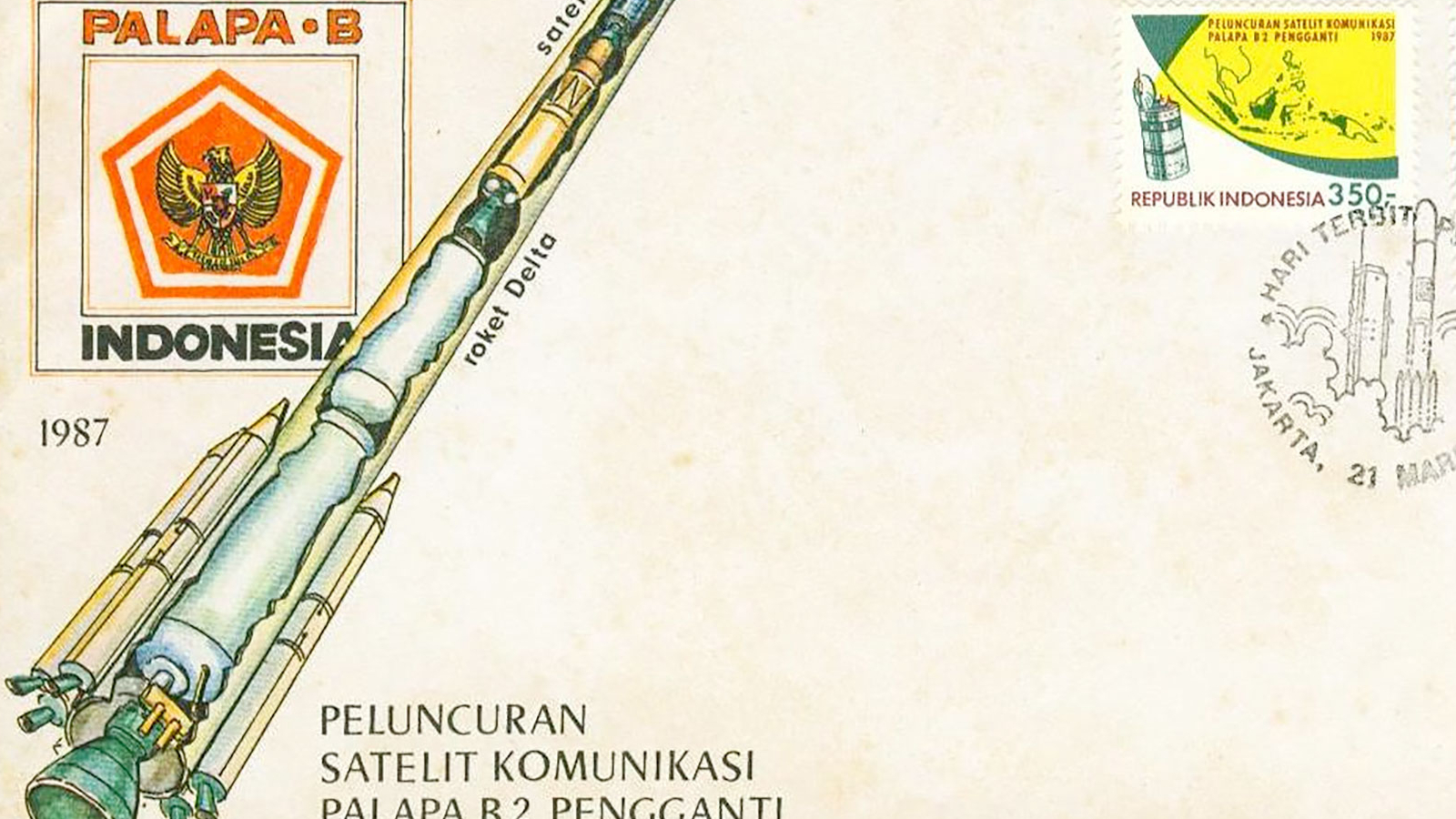 an envelope decorated with an illustration of a rocket and postmarked with two commemorative stamps for a satellite launch