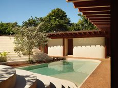 a sculptural Patio house in Costa Rica, textured, low volumes among tropical greenery